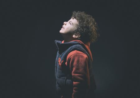 Little Boy Wearing Black And Red Jacket