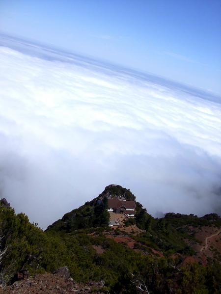 Lodge in the mountain above clouds