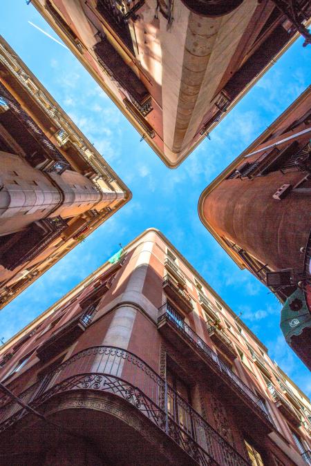 Low Angle Photo of Four Brown Concrete Buildings