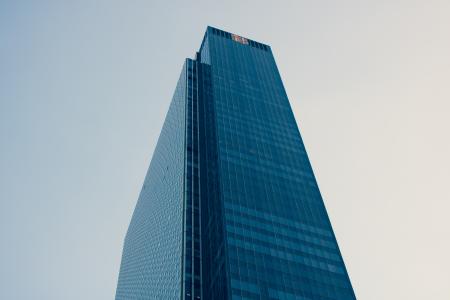 Low Angle Photography of Curtain Building Under White Sky