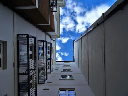 Low-angle Photography of Gray Concrete Building Under Blue Sky at Daytime