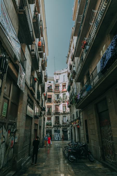 Low Angle Shot of Two People Walking on Alley