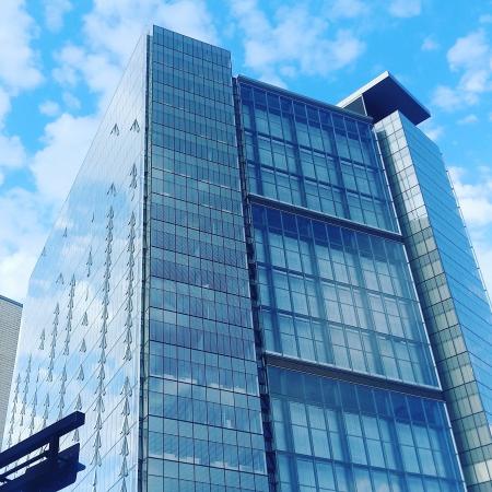 Low Angle View of Glass High Rise Building during Cloudy Daytime Photo