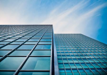 Low Angle View of Office Building Against Blue Sky