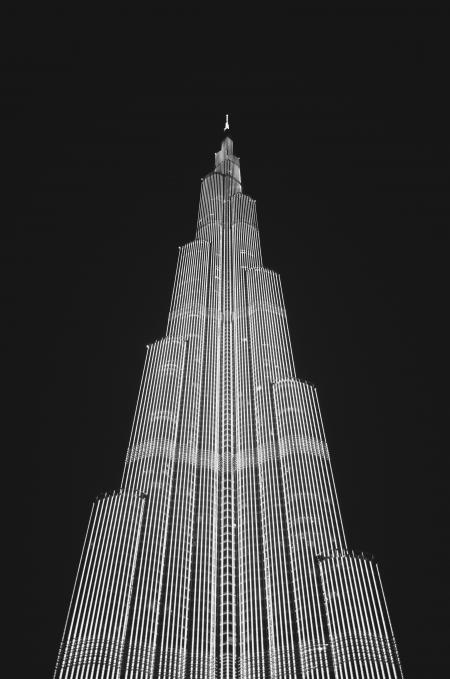 Low Angle View of Skyscraper Against Sky at Night