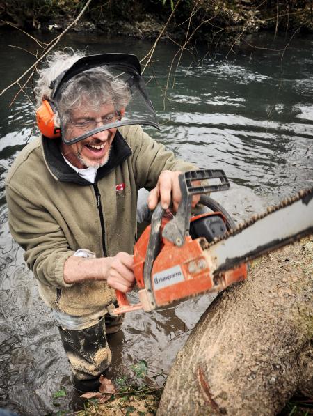 Lumberjack Worker With Chainsaw