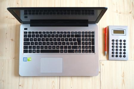 Macbook Pro Beside Gray Rectangular Device