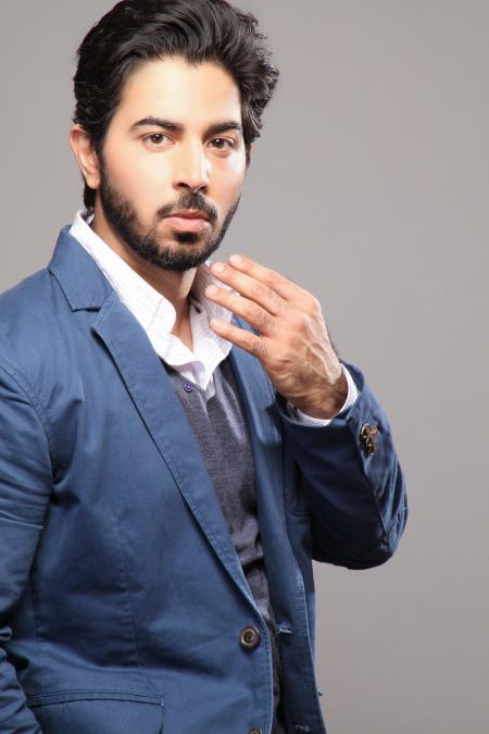 Man About to Touch His Face Wearing Blue Suit