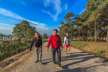 Man and Two Women Walking