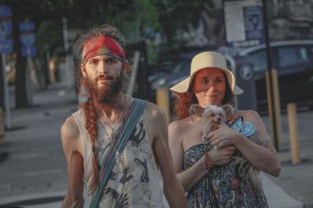 Man And Woman Standing On Sidewalk