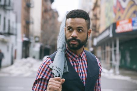 Man Holding Black Umbrella