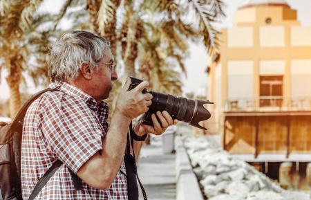 Man Holding Dslr Camera