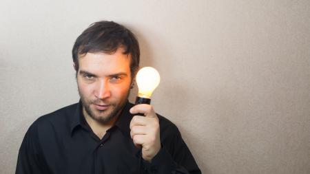 Man holding light bulb