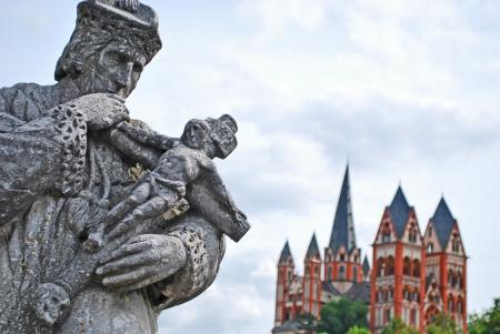 Man Holding Man on Cross Gray Statue