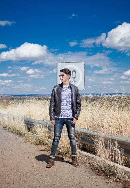 Man in Black Leather Zip-up Jacket and Black Jeans Wearing Black Sunglasses