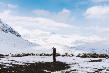 Man in Black Shirt Standing on White Snow Field