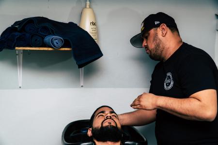 Man in Black Shirt Staring at Man