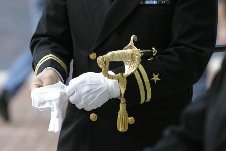 Man In Black Suit Wearing Gloves