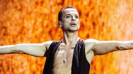 Man in Black Vest Lifting His Hands