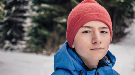 Man in Blue Hoodie Jacket With Red Beanie