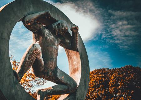 Man in Circle Concrete Statue