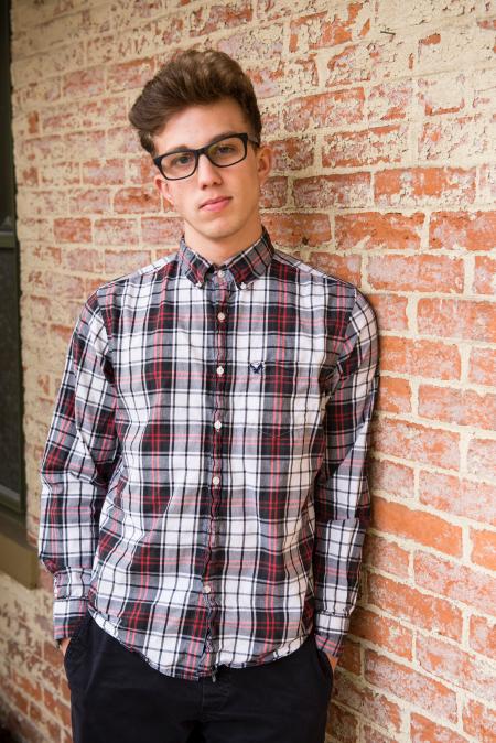 Man In Plaid Dress Shirt And Black Pants Wearing Eyeglasses