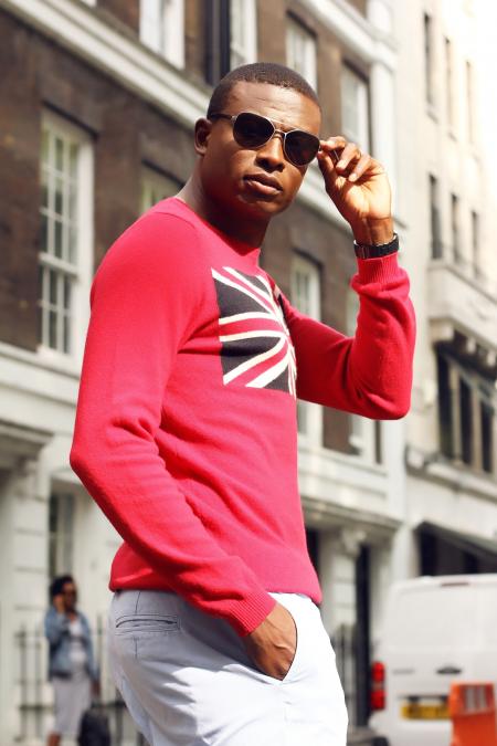 Man in Red and White Clothes Standing Near Street