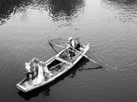 Man in White Boat