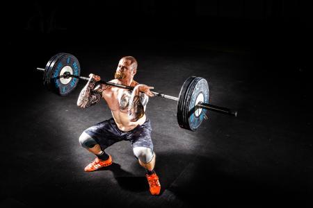 Man Lifting a Barbell