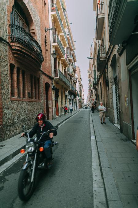 Man Riding Black Standard Motorcycle