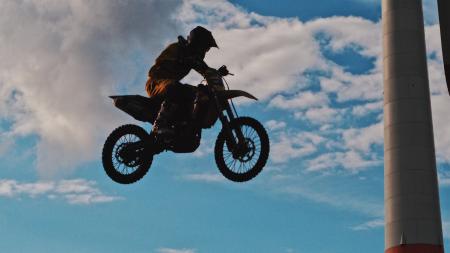 Man Riding Motocross Dirt Bike