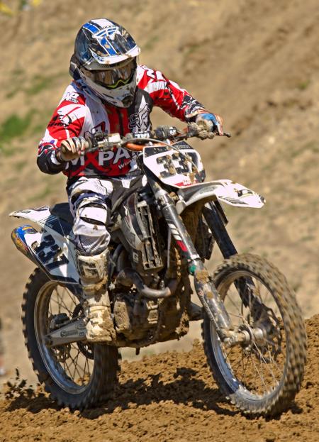 Man Riding Off Road Motorcycle on Trail