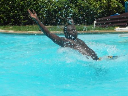 Man Splashing in the Swimming Pool