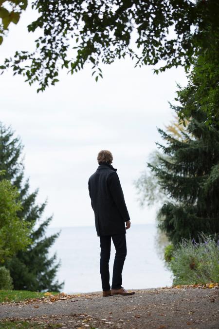 Man Standing in the Middle of Empty Road