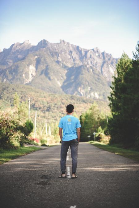 Man Standing on Road