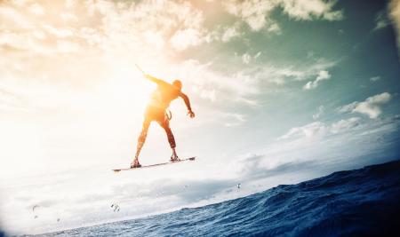 Man Wakeboarding over Body of Water