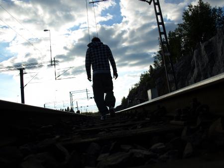 Man walking in railroad