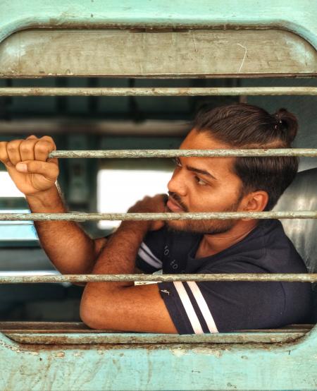 Man Wearing Black Crew-neck T-shirt Inside Green Vehicle