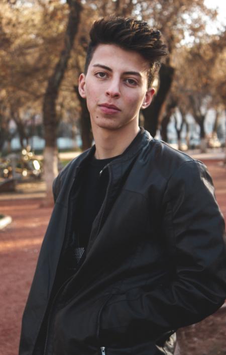 Man Wearing Black Leather Jacket With Black Shirt Photo