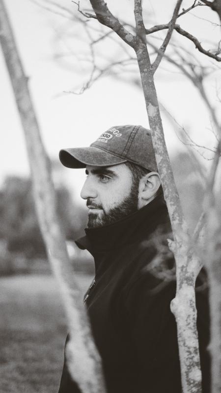 Man Wearing Gray Baseball Cap and Black Zip-up Jacket