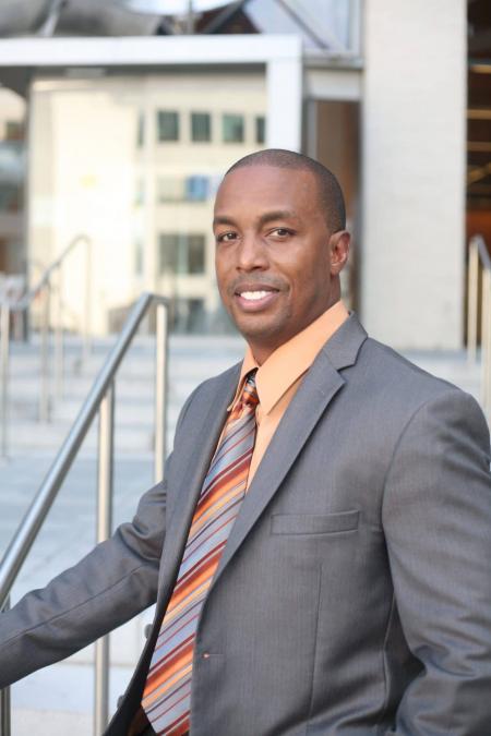 Man Wearing Gray Blazer and Orange Dress Shirt