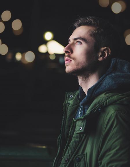 Man Wearing Green Zip Jacket