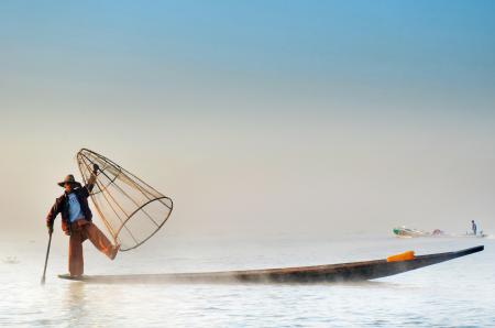 Man Wearing Jacket Riding Canoe