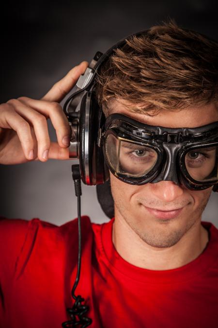 Man Wearing Red Crew Neck Shirt and Black Goggles