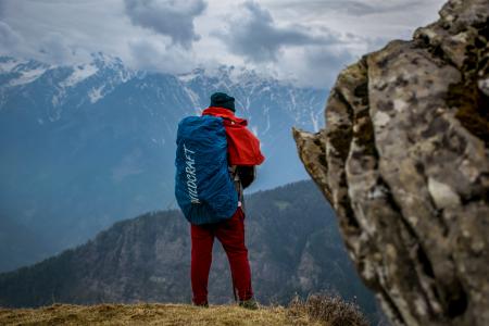 Man Wearing Red Pants on Cliff