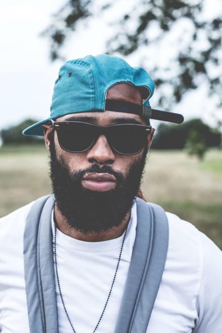 Man Wearing Sunglasses and Denim Strap Back Cap