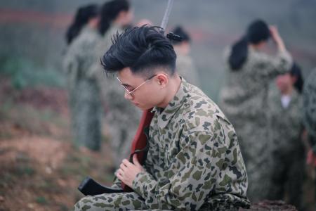 Man Wearing Sunglasses Holding Rifle