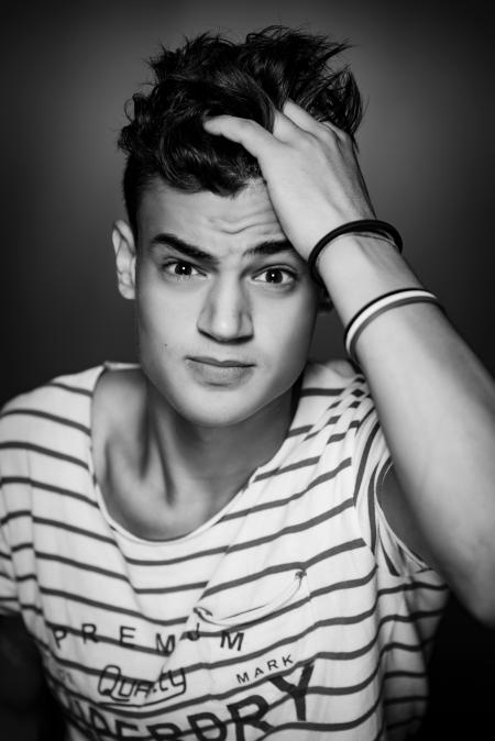 Man Wearing White and Black Striped T-shirt