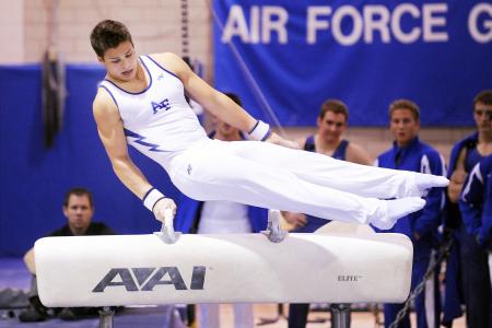 Man Wearing White and Blue Shirt Jumping on White Avai Table