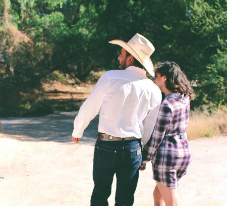 Man Wearing White Dress Shirt And White Cowboy Hat